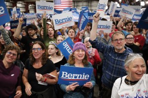 Supporters cheer as primary election results are shown on television during a Super Tuesday night rally with Democratic presidential candidate Sen. Bernie Sanders (I-VT) at the Champlain Valley Expo March 03, 2020 in Essex Junction, Vermont.