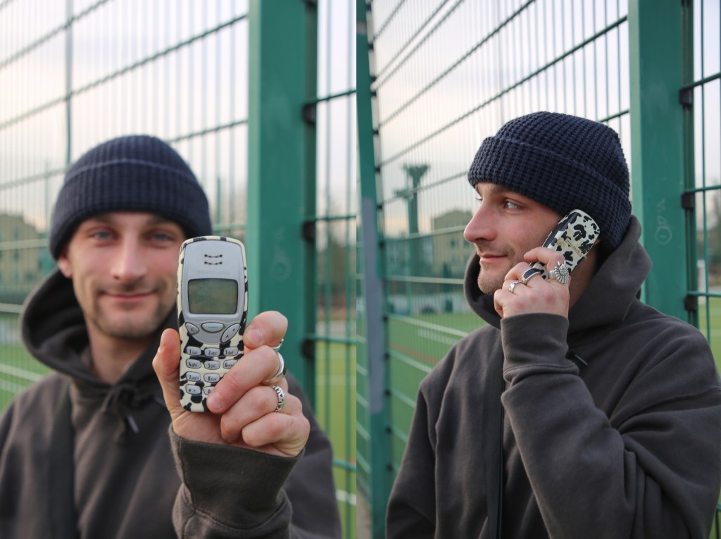 Man holding brick phone