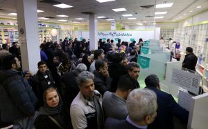 Iranians wait to get prescription drugs at the state-run "13 Aban" pharmacy in Tehran on February 19, 2020. - Iranians had been suffering from scarce medicine supplies even before the new coronavirus COVID-19 broke out in the central city of Qom and sprea