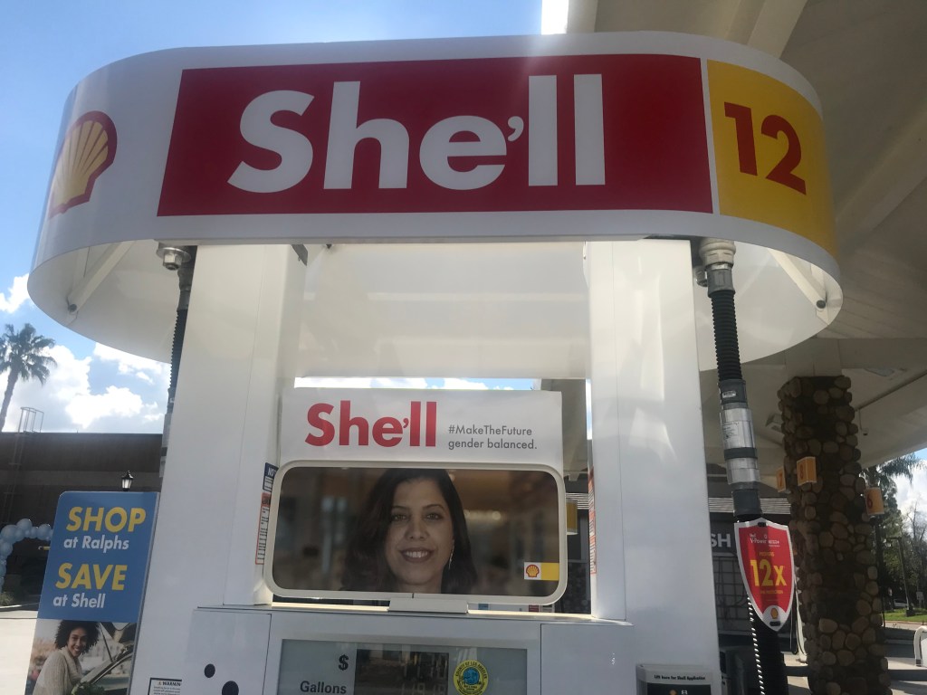 A gas pump that has been rebranded "She'll."