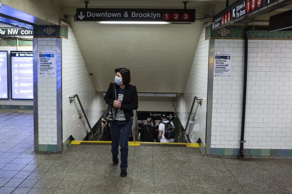 Woman wearing mask in NYC subway