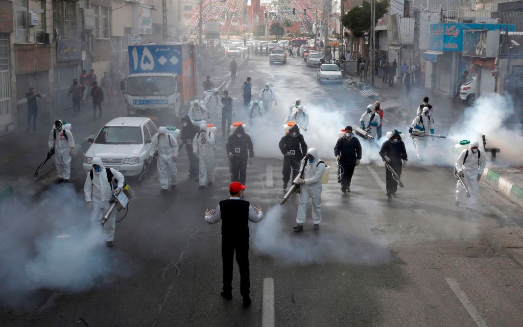 Iranian Firefighters disinfect streets in the capital Tehran in a bid to halt the wild spread of coronavirus on March 13 2020.