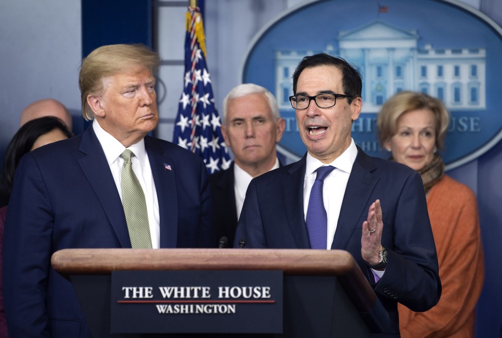 Steven Mnuchin, U.S. Treasury secretary, right, speaks beside U.S. President Donald Trump during a Coronavirus Task Force news conference in the briefing room of the White House in Washington, D.C., U.S., on Tuesday, March 17, 2020.