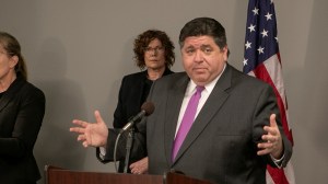 Gov. J.B. Pritzker speaks at a news conference in Belleville, Ill., Wednesday, March 18, 2020.  (Derik Holtmann/Belleville News-Democrat via AP)