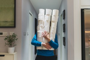 Person holding a lot of toilet paper.