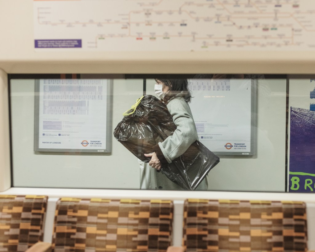 Woman in a coronavirus mask on the Tube