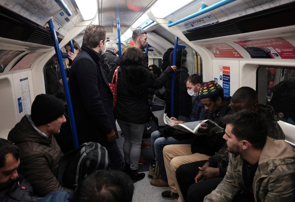 A packed carriage full of passengers travelling on the Victoria line of the London Underground tube network, after Boris Johnson ordered pubs and restaurants across the country to close tonight as the Government announced unprecedented measures to cover t