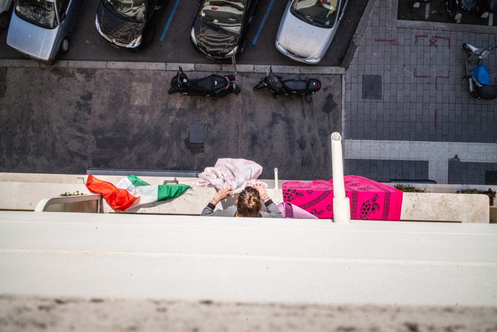 woman hanging clothes out to dry