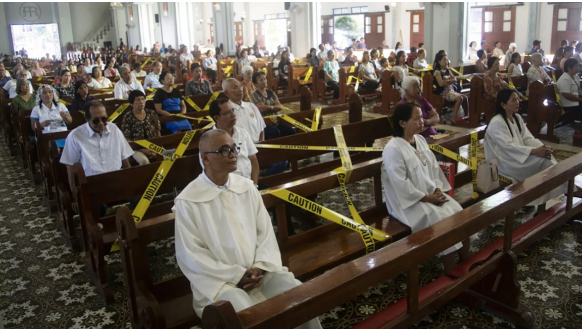 Churchgoers at Catholic church in Borongan town in central Philippines