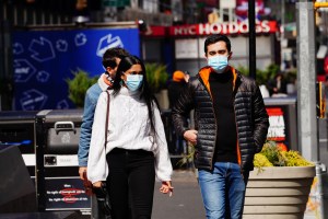 People wearing masks in Times Square amid the coronavirus (COVID-19) outbreak on March 24, 2020 in New York City