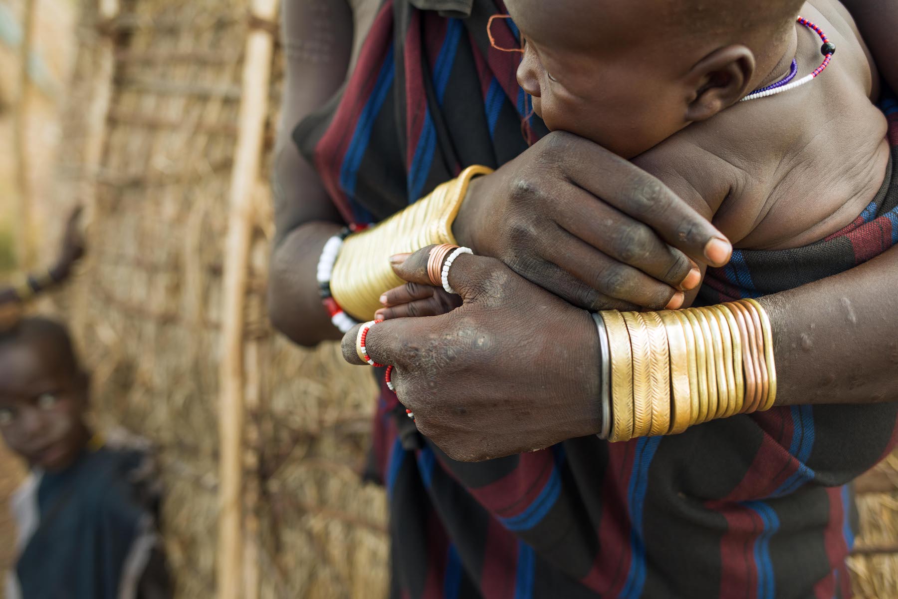 1585227569627-Mursi-mother-and-infant-Roc-Morin