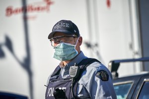 Police officer in surgical mask