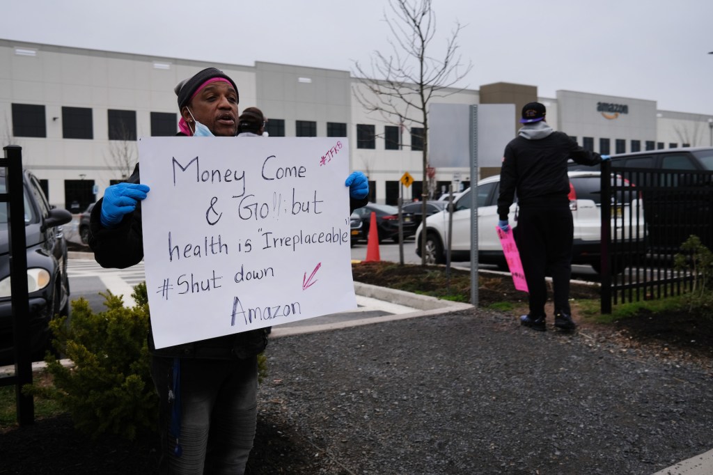 Amazon employees hold a protest and walkout over conditions at the company's Staten Island distribution facility on March 30, 2020 in New York City.