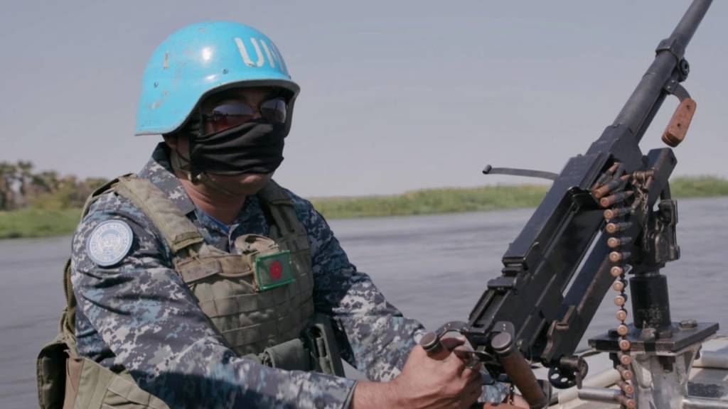 A Bangladeshi peacekeeper patrols the Upper Nile River near Malakal, South Sudan.