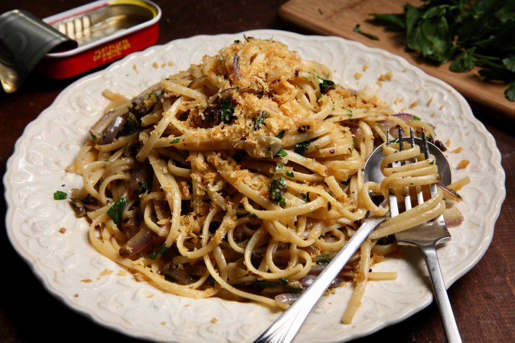 a plate of anchovy and caper pantry pasta topped with fried breadcrumbs