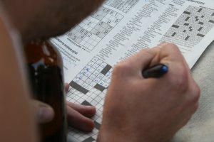 Someone solving a crossword.