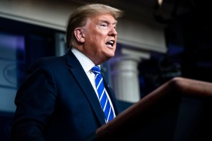 President Trump addresses the media, orangely, from a podium