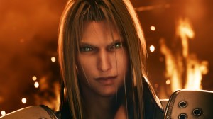 Screenshot from Final Fantasy VII Remake. Game antagonist Sephiroth,a man with white skin, long grey hair, and green cat eyes is framed close up with a fire burning behind him.