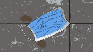 An illustration of a discarded face mask lying on the street.