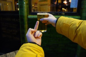 man swearing at pint