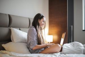 A woman using a laptop.