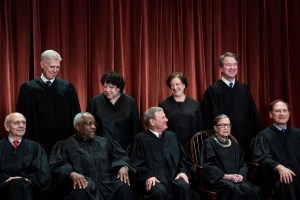 Justices of the United States Supreme Court sit for their official group photo at the Supreme Court on Friday, Nov. 30, 2018 in Washington, DC.