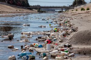 Large amounts of trash and plastic refuse collect in Ballona Creek after first major rain storm, Culver City, California, USA.