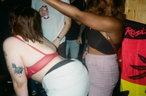 two women grinding in nightclub