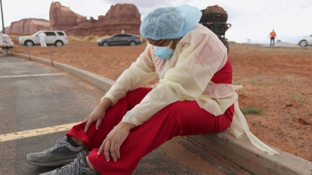 Vehicles line up for COVID-19 testing outside of the Monument Valley Health Center in Oljato-Monument Valley, San Juan County, on Friday, April 17, 2020. More than 1,000 people got tested over the course of two days. (Kristin Murphy/The Deseret News via A