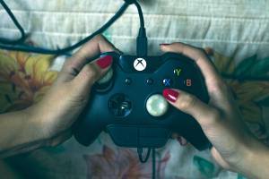 person-holding-microsoft-xbox-one-controller-1666759