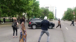 Screenshot of car hitting protester at Denver George Floyd via video posted to Annabel Escobar's Twitter.​