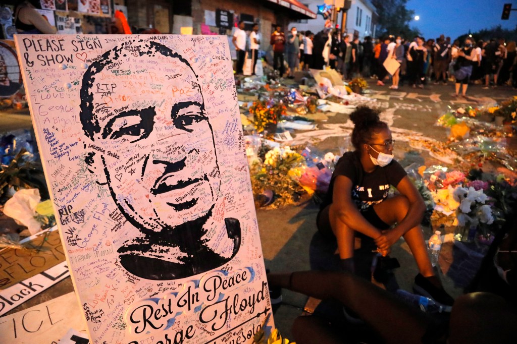 A makeshift memorial is seen at the place where George Floyd died, Monday, June 1, 2020, in Minneapolis. Protests continued following the death of Floyd, who died after being restrained by Minneapolis police officers on Memorial Day.