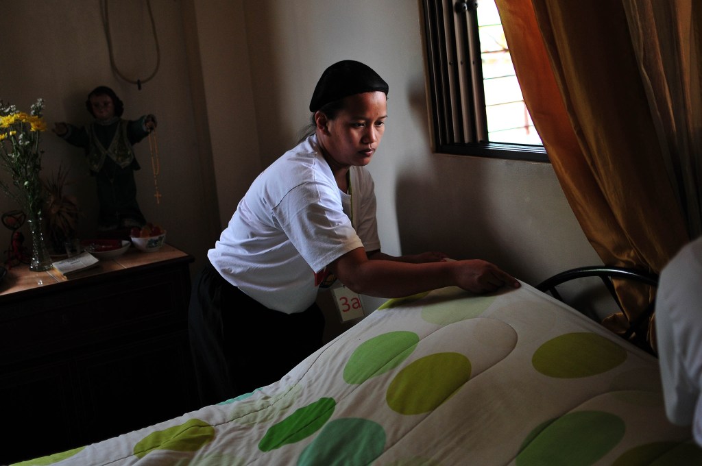 A woman training to be a caregiver in the Philippines.