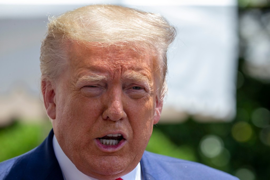 U.S. President Donald Trump talks to the media outside the White House as he heads to the SpaceX launch in Florida on May 30, 2020 in Washington, DC.