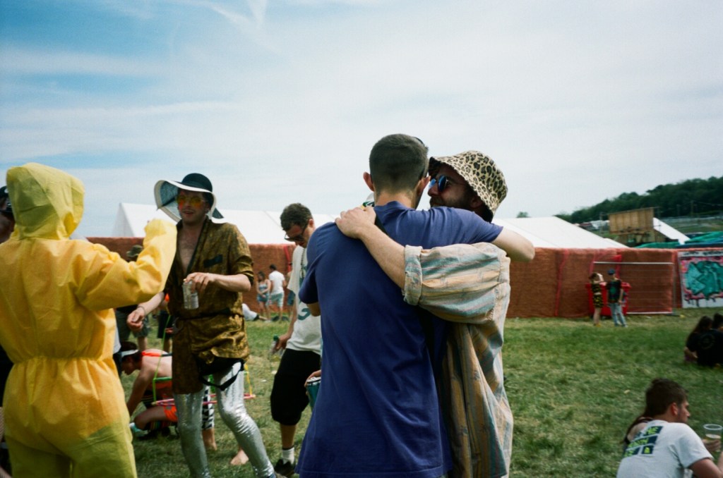 Two people hugging at a festival