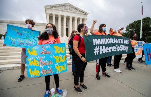 Deferred Action for Childhood Arrivals (DACA) students celebrate in front of the U.S. Supreme Court after the Supreme Court rejects President Donald Trump's bid to end legal protections for young immigrants, Thursday, June 18, 2020, in Washington.