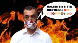 Cem Özdemir vor einer Wand aus Flammen. Der Politiker hatte vor laufenden Kameras gesagt "Halten Sie bitte die Fresse".