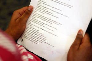 A student waits to read her poem at Lakeside Academy, in Kalamazoo, Mich. Speak It Forward is an ongoing program at Lakeside that allows students to express their experiences and life-stories in an extemporaneous style. (AP Photo/The Gazette, Mark Bugnask