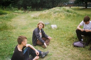 Group of boys sat outside talking