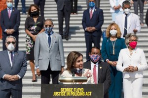 House Speaker Nancy Pelosi of Calif., joined by House Democrats spaced for social distancing, speaks during a news conference on the House East Front Steps on Capitol Hill in Washington, Thursday, June 25, 2020.