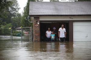 People in Houston, Texas wait to be rescued after the area was flooded from Hurricane Harvey in August 2017. Photo by Joe Raedle/Getty Images​