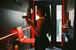 a sex worker in her room in Amsterdam's red light district