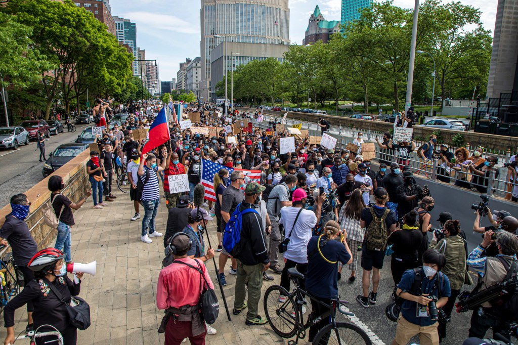 Protesters walking across the Brooklyn Bridge after a peaceful memorial for George Floyd held at Cadman Plaza Park in Brooklyn, New York, NY on June 4, 2020.