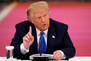 President Donald Trump answers questions from reporters during a roundtable with people positively impacted by law enforcement, Monday, July 13, 2020, in Washington. (AP Photo/Evan Vucci)​