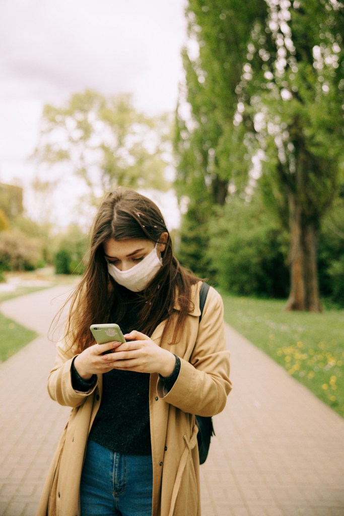 woman-in-brown-leather-jacket-using-smartphone-4662948