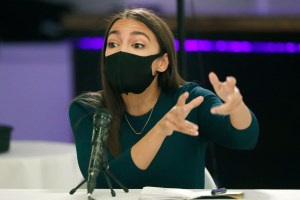 Rep. Alexandria Ocasio-Cortez, D-N.Y., gestures during a debate ahead of New York's June 23 primary election, Wednesday, June 17, 2020, in New York. Three of the four candidates attended.