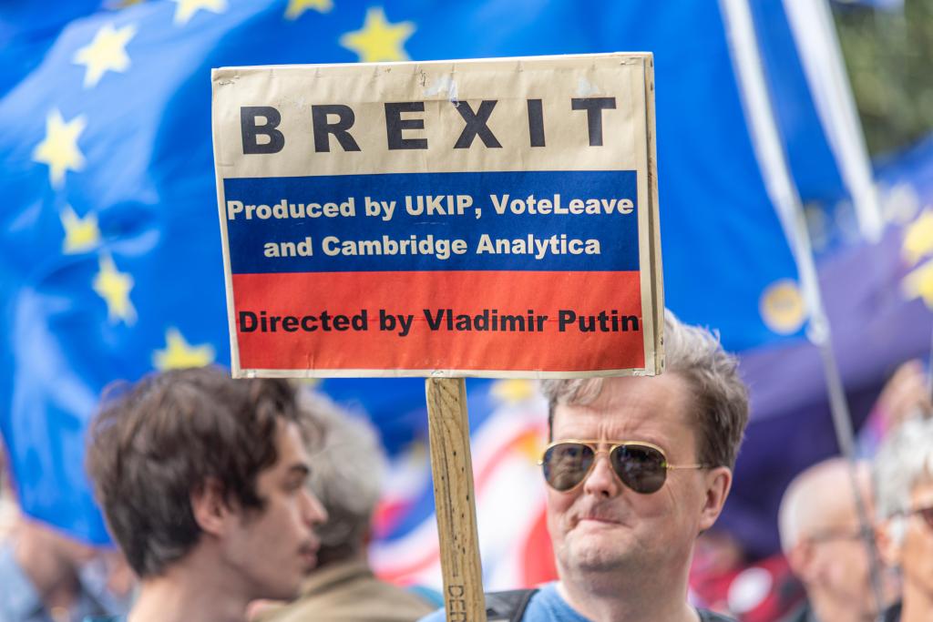 A protester holds a sign up during a Brexit protest as Parliament resumed after summer recess in 2019.​ ​