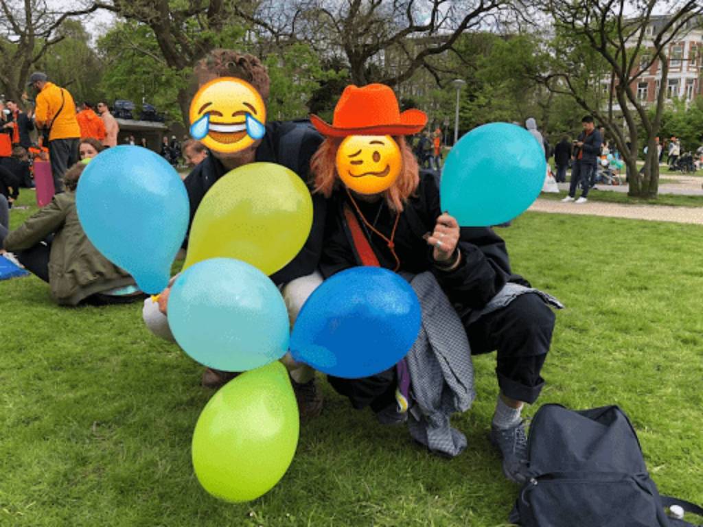 People in a park using laughing gas.