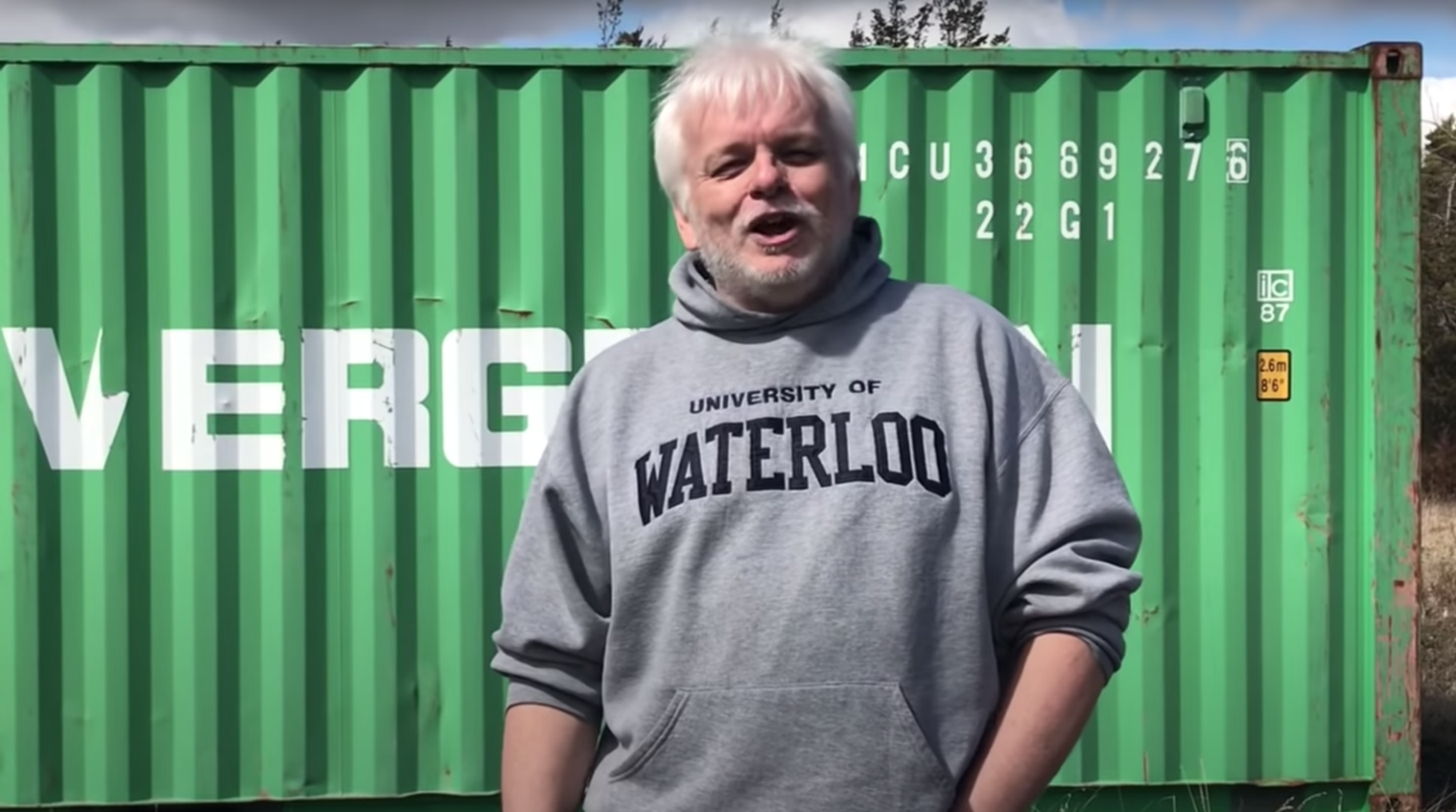 Brummell in one of his most popular videos. He claims the shipping container behind him is used in the sex-trafficking of children. Photo via screenshot.