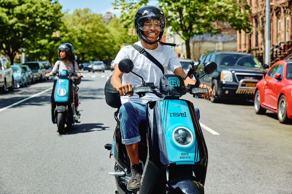 Rider using Revel electric scooter. The company suspended service in NYC following two deaths in a little over a week.